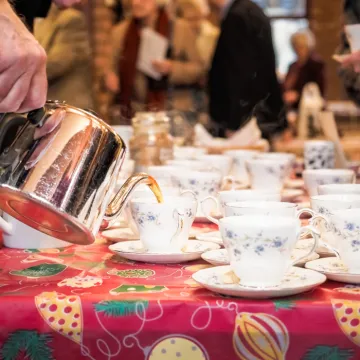 Pouring a cup of tea after the service