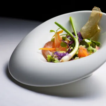 A salad starter in a white dish