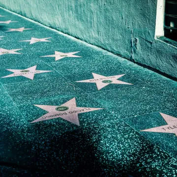 View of Hollywood Walk of Fame with stars on the sidewalk in Los Angeles, California.