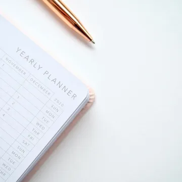 A stylish yearly planner open to a 2020 calendar