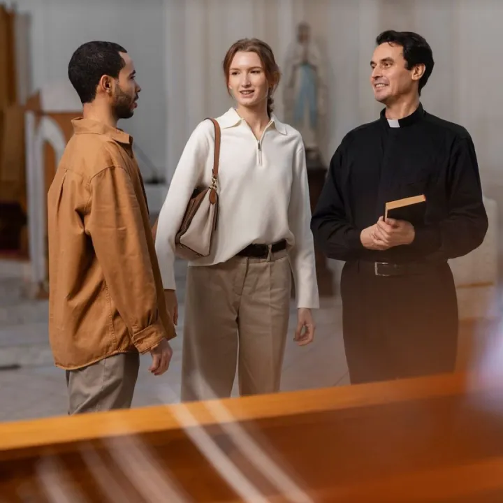 People visiting and praying in church building