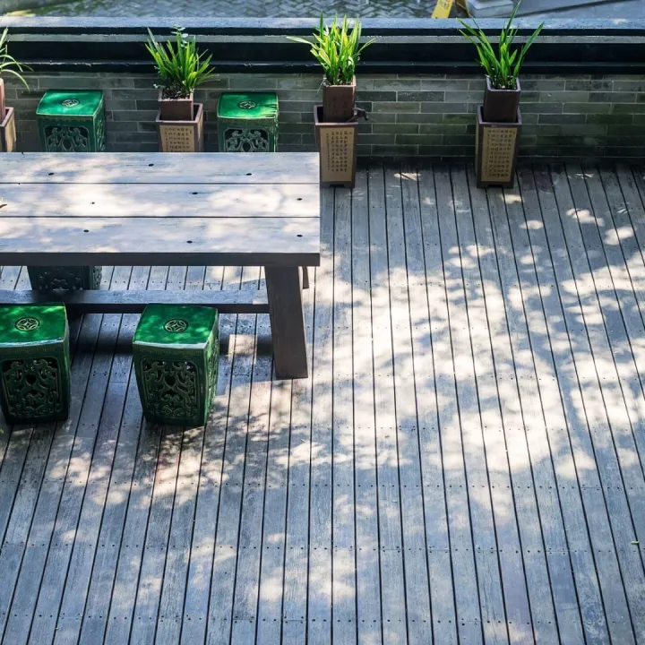 Terrace with a wooden table and plants