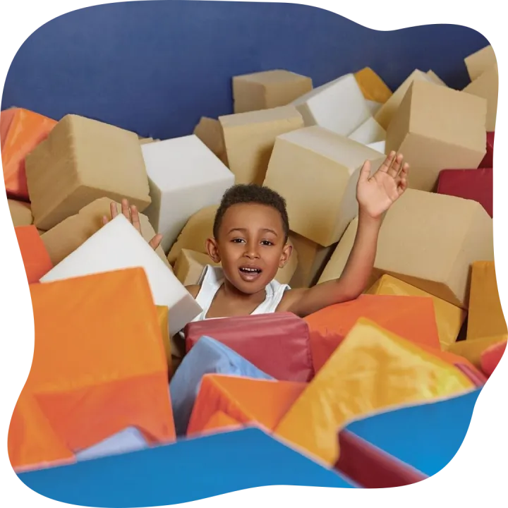 Portrait of cheerful energetic Afro American little boy havi