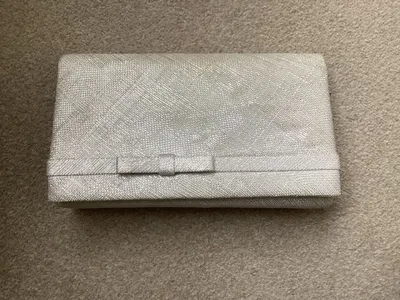 Items for sale
– Silver grey clutch bag £10