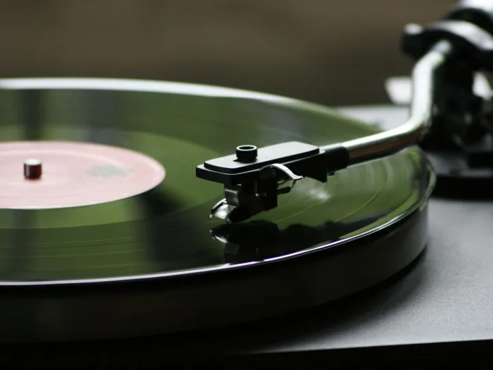 A close-up view of a rotating vinyl record on a