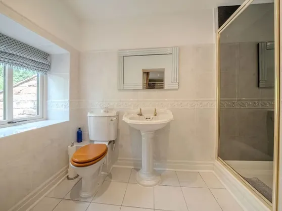 The en-suite shower room to bedroom three