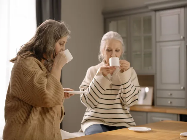 Two friends sharing coffee and conversation