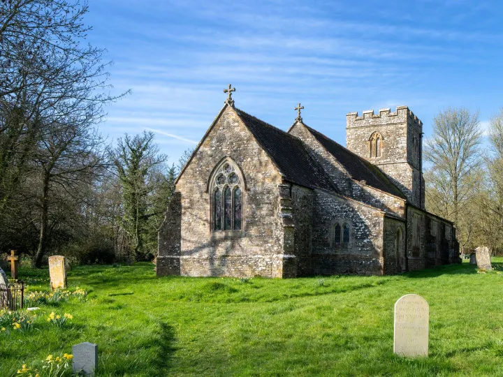 A country church surrounded by greenery