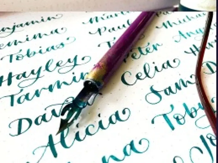 Hand written wedding place cards in blue modern calligraphy