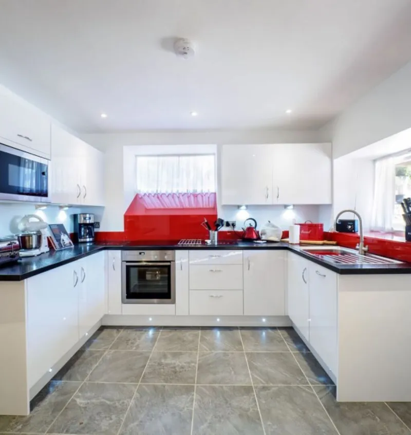 The modern open plan kitchen at Otters Retreat with built in appliances