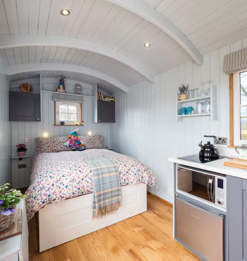 Inside the Shepherd’s Crook with its double bed and kitchen