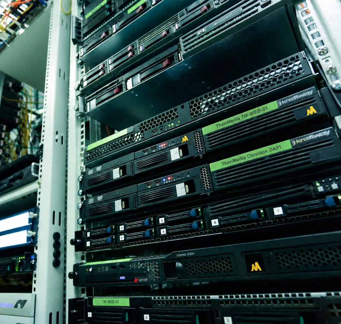Servers in a rack, labelled ThenMedia and Chrestos