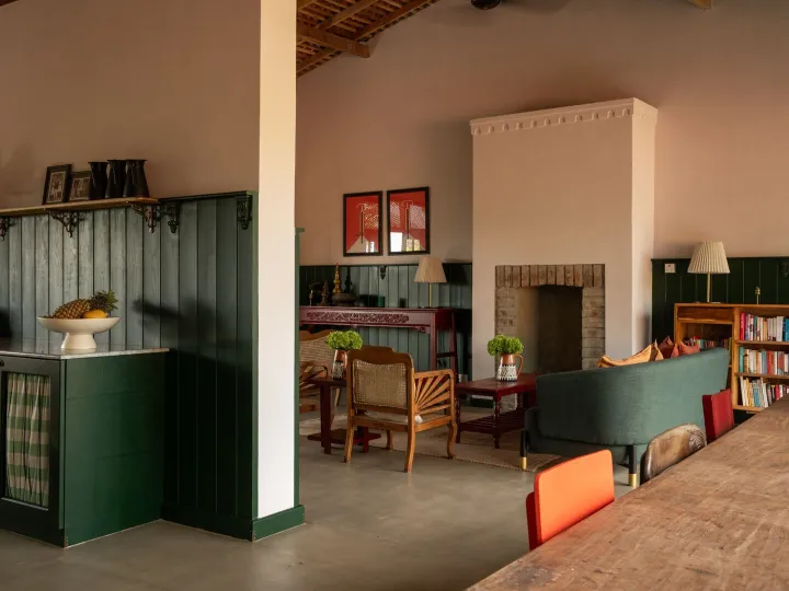 The lounge and dining area with green panelling at Peacock Hill Sigiriya