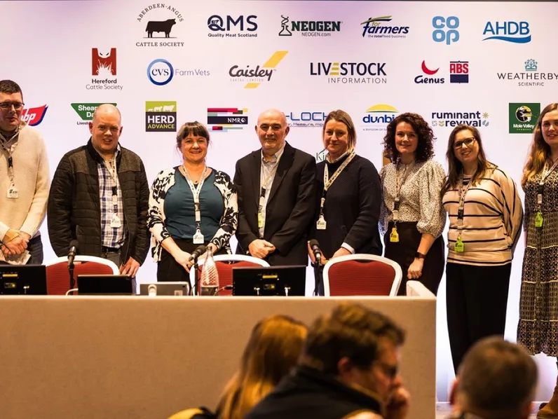Conference speakers line up on stage