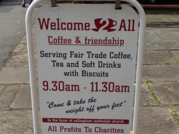 Welcome 2 all Cafe street sign