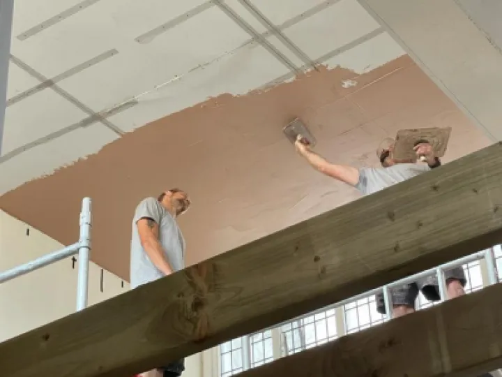 Plastering the ceiling above the choir stalls