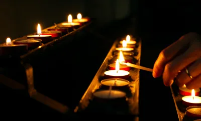 Lighting candles in church