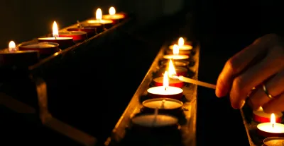 Lighting candles in church