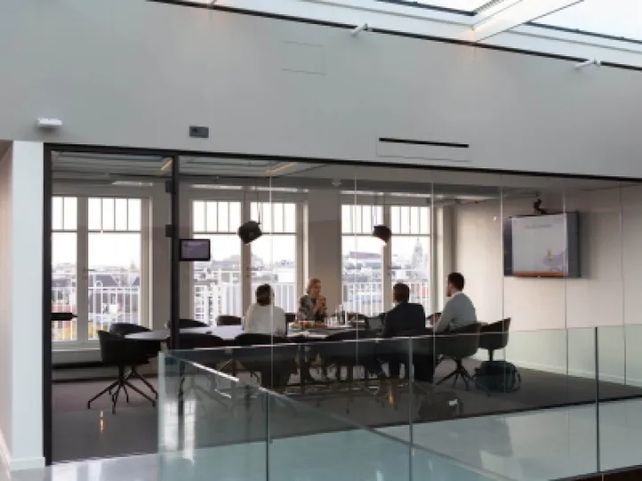 Four people in a business meeting