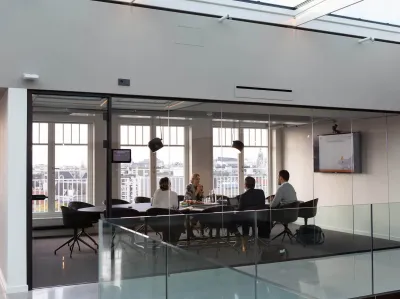 Four people in a business meeting