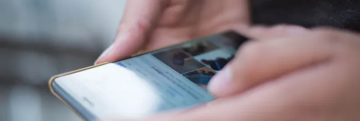 Person Using Smartphone Shallow Focus Photography