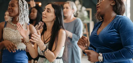 A Group of Women Singing Together
