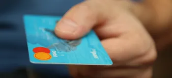 Person Holding Debit Card