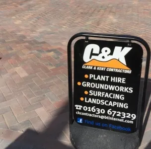 Clark & Kent patio laying advert panel