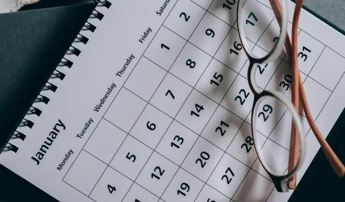 Brown-Framed Eyeglasses on a Calendar
