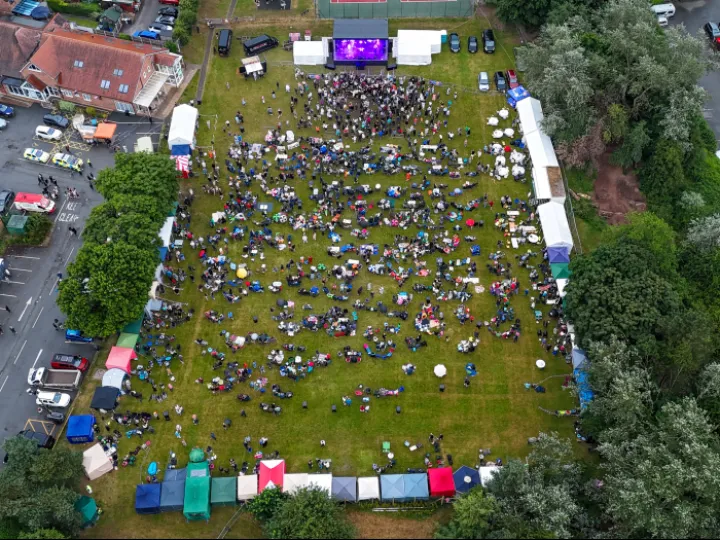 Aerial View of Calling Planet Earth Performing  1