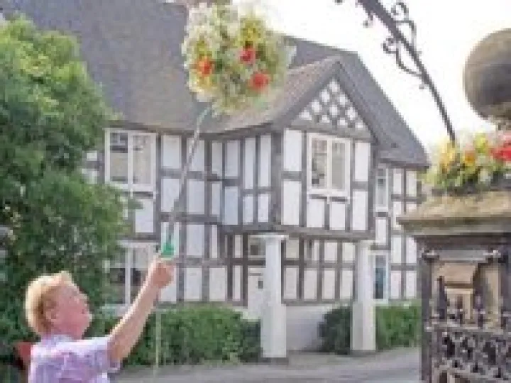 Watering the flower baskets