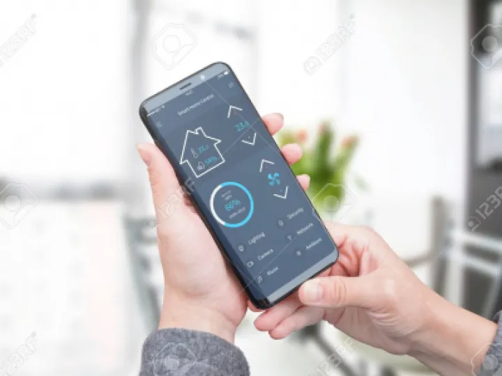 Image: 101852838 woman use modern mobile app with modern flat design interface to control home security lighting and