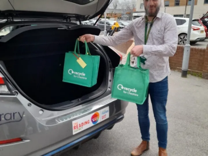 Liam At Back Of Electric Vehicle