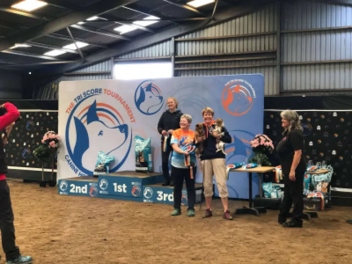 Astrid with Lizzie and Hannah receiving their rosettes