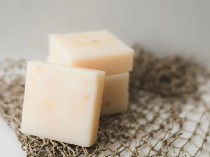 Close-up of creamy cheese blocks stacked on