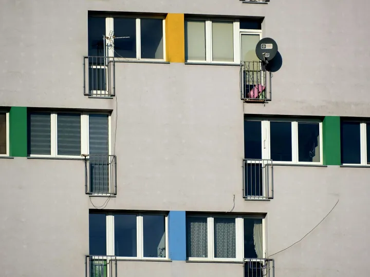 Close-up of a modern apartment building facade wit