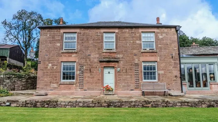 Mellor Knowl Farmhouse, the Georgian stone farmhouse and its front door at Wincle